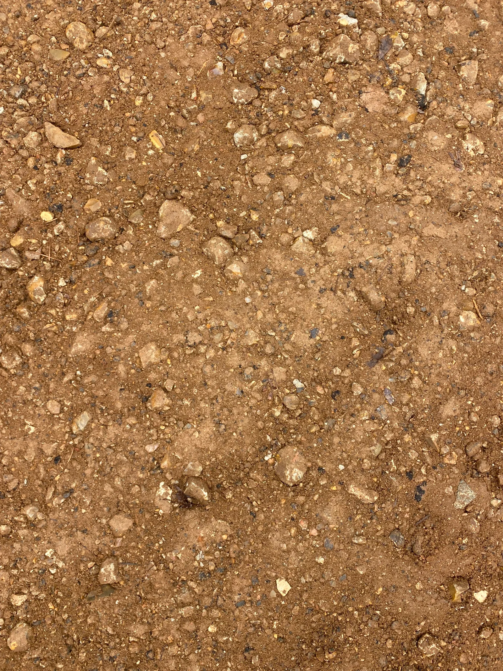 Compacted soil and aggregate base layer for site preparation and grading work